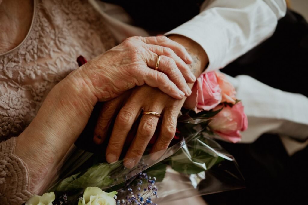 Anniversary gift ideas for long distance parents, elderly couple holding hands.
