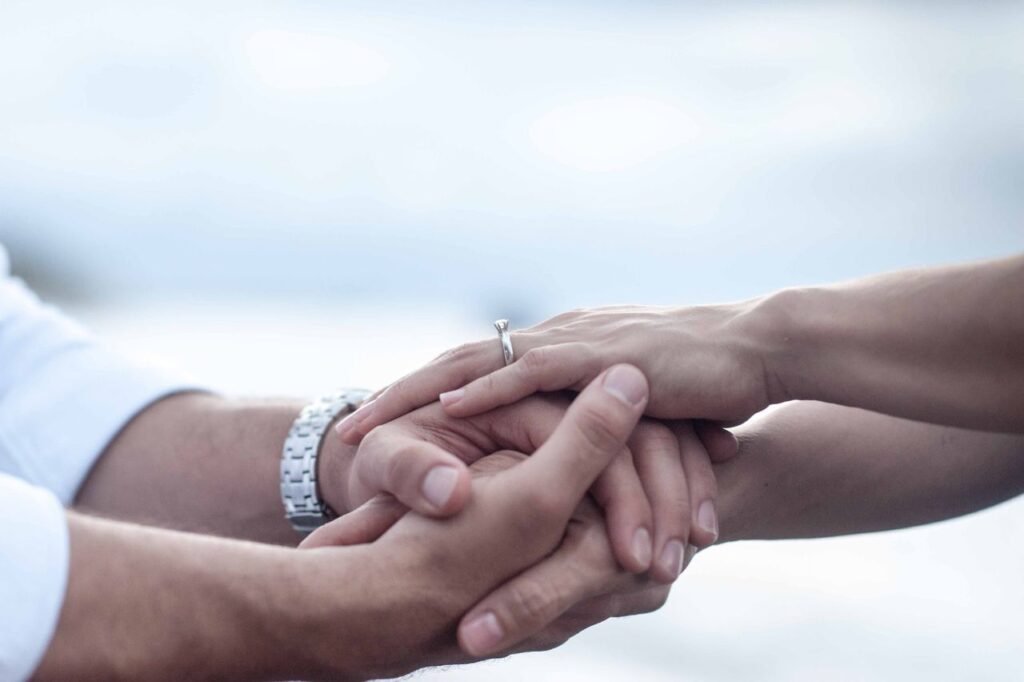 Anniversary gift ideas for a long distance partner, couple holding hands.